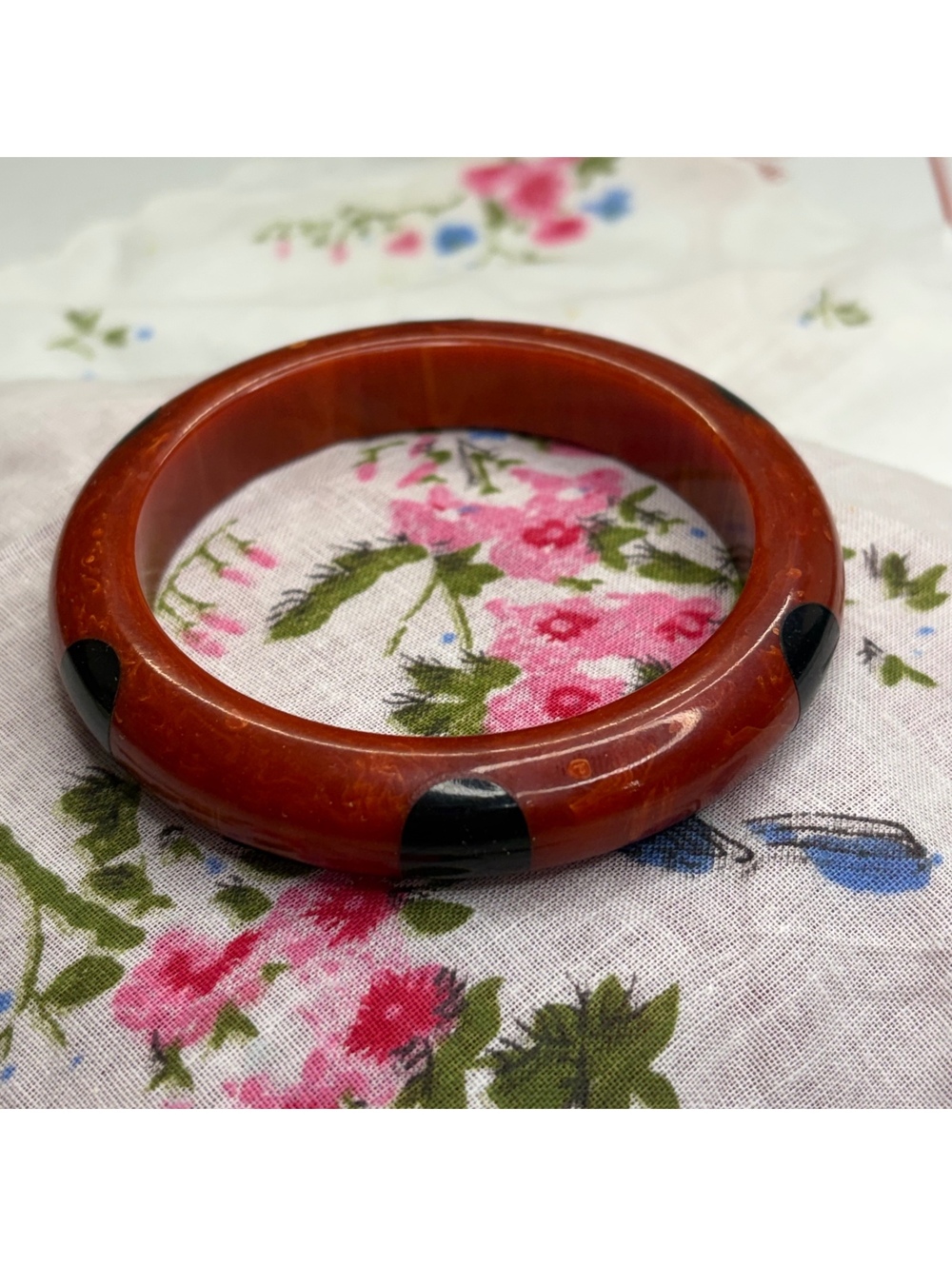 Bakelite red swirl with black dot inlay bangle vintage